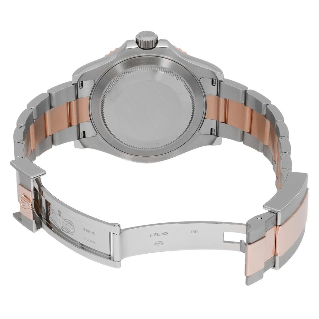 An image of a pre-owned wristwatch from a back view, displaying the open clasp. The watch has a stainless steel and rose gold-toned bracelet. The angle is slightly elevated and taken from a moderate distance, highlighting the smooth metal finish and the intricate clasp detailing.