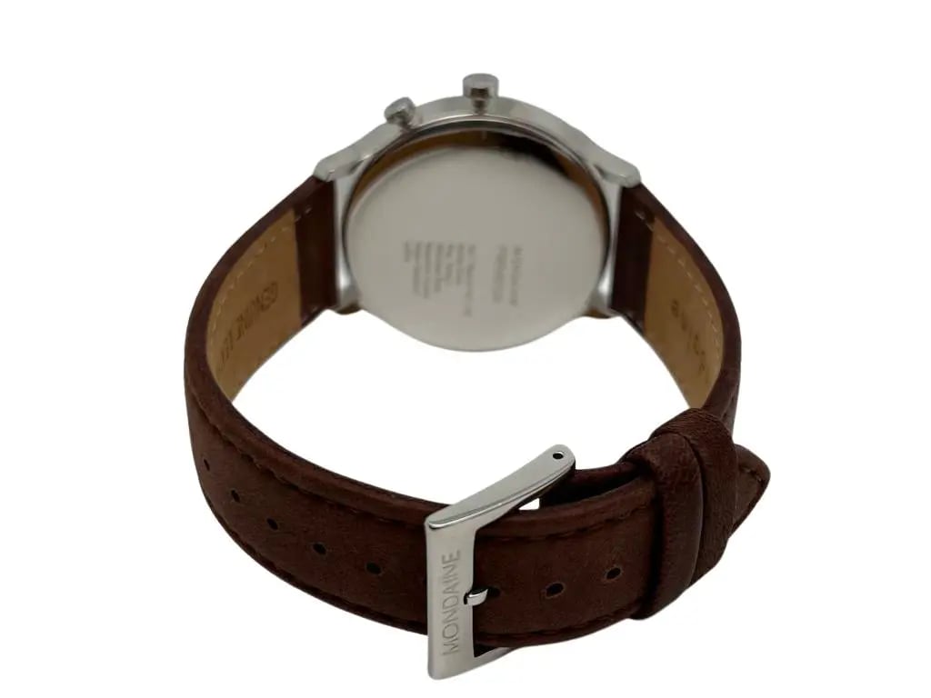 An image of a Wristwatch by Mondaine. This Display Model item is designed for Men, featuring a Casual style. It has a Quartz movement and an Analog display with a White dial color. The indices include 12-Hour Dial,Arabic Numerals. The band is made of Leather and the case is made of Stainless Steel. The watch has a Round shape with a case size of 40 mm and a case thickness of 9 mm.