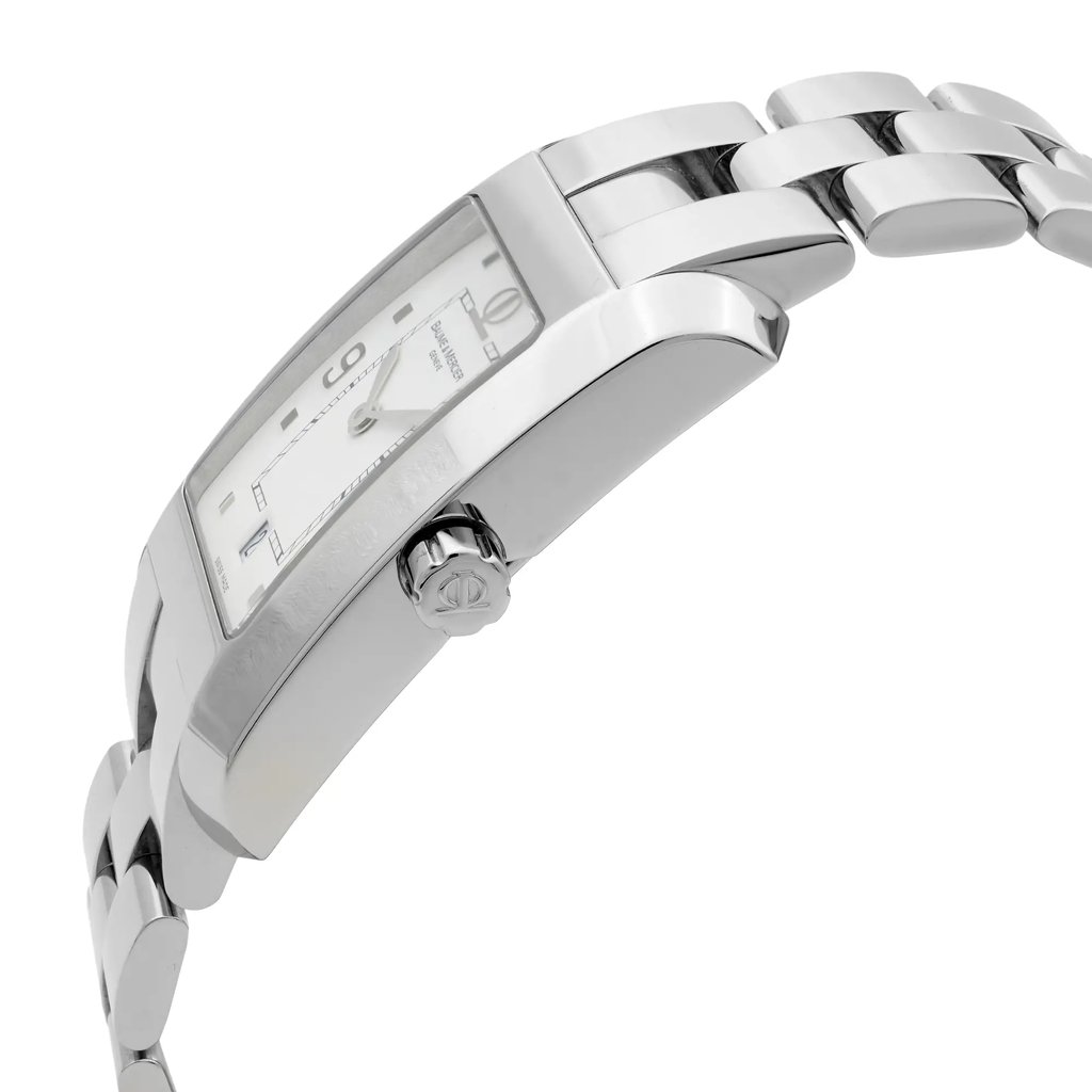 An image of a wristwatch taken from a side profile view, showcasing the crown prominently. The watch features a polished metal bracelet and a rectangular face. The angle highlights the design and curvature of the watch case, emphasizing its sleek and elegant appearance. The image is taken at a close distance to capture fine details of the display model.