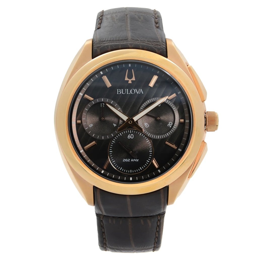 An image of a new with defects Bulova men's wristwatch in a casual style, shown in a full frontal view. The timepiece features a brown dial with stick indexes, three subdials, and luminous hands within a rose gold-tone bezel. It has a round stainless steel case and is attached to a dark brown leather band. The watch is positioned straight on the camera, with the face fully visible and the band partially folded behind, all captured from a close distance to show detail. Features include a chronograph and a small seconds subdial.