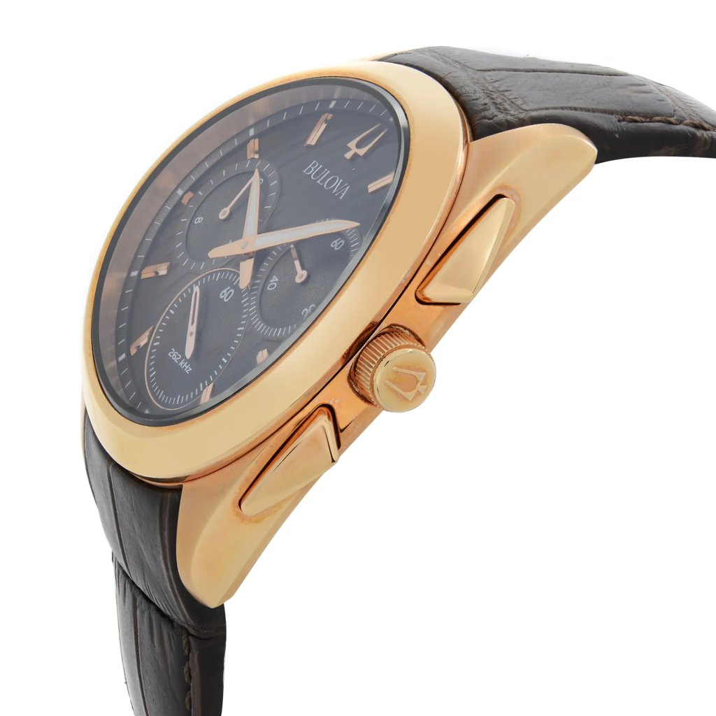 An image of a new Bulova men's wristwatch with defects, shown in a side profile view with the crown visible. The watch features a round stainless steel case with a rose gold-tone bezel, a brown dial, and a leather band. It includes a chronograph, luminous hands, and a small seconds subdial. The photo is taken from a close distance, highlighting the side angle and details of the watch's design.