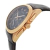 An image of a new Bulova men's wristwatch with defects, shown in a side profile view with the crown visible. The watch features a round stainless steel case with a rose gold-tone bezel, a brown dial, and a leather band. It includes a chronograph, luminous hands, and a small seconds subdial. The photo is taken from a close distance, highlighting the side angle and details of the watch's design.