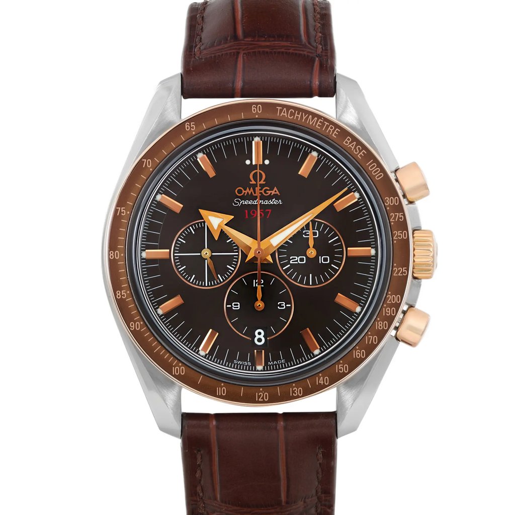 An image of a pre-owned wristwatch taken from a front close-up angle, showcasing the watch face in detail. The watch features a brown dial with gold-tone hands and markers, along with three subdials. The bezel is brown with a tachymeter scale, and the watch has a brown leather strap. The brand name is visible on the dial.