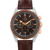 An image of a pre-owned wristwatch taken from a front close-up angle, showcasing the watch face in detail. The watch features a brown dial with gold-tone hands and markers, along with three subdials. The bezel is brown with a tachymeter scale, and the watch has a brown leather strap. The brand name is visible on the dial.