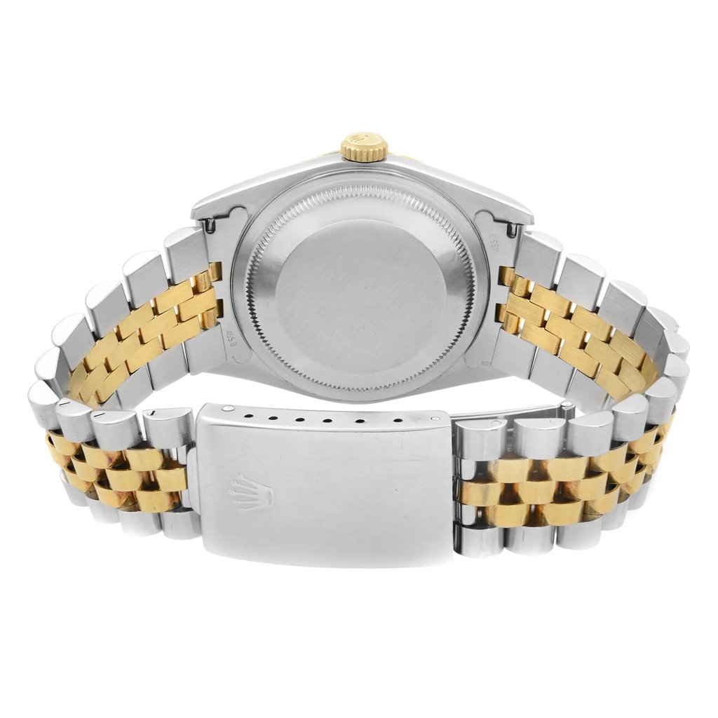 An image of a pre-owned men's Rolex wristwatch, viewed from the back at a close angle. The focus is on the stainless steel and gold bracelet, with the watch case visible at the top of the image. The crown is positioned at the top center, and the clasp with the Rolex logo is prominently displayed at the bottom center. The watch is positioned horizontally, showcasing its two-tone metal design.