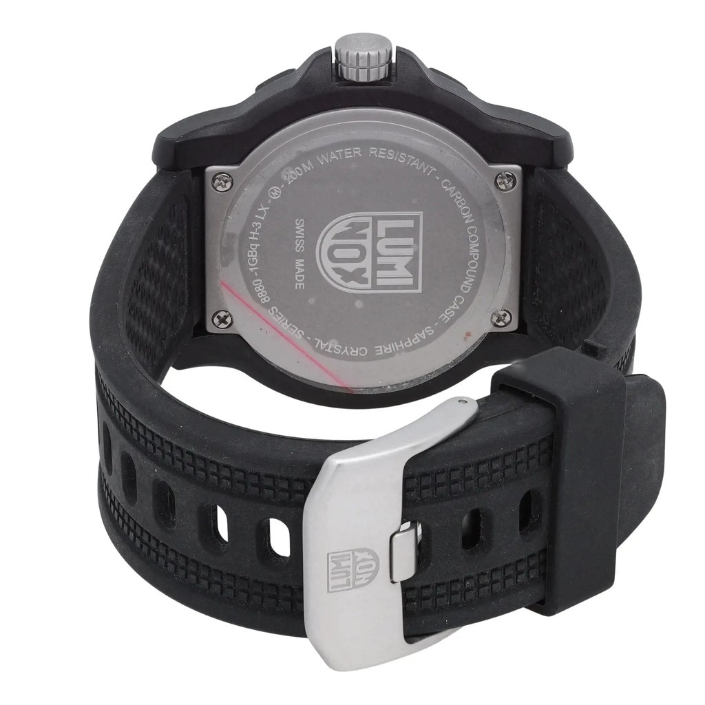 An image of a Wristwatch by Luminox. This Pre Owned item is designed for Men, featuring a Casual style. It has a Quartz movement and an Analog display with a Black dial color. The indices include 12-Hour Dial,24-Hour Dial,Easy to Read/Large Numerals. The band is made of Rubber and the case is made of Carbon. The watch has a Round shape with a case size of 45 mm and a case thickness of 13 mm.