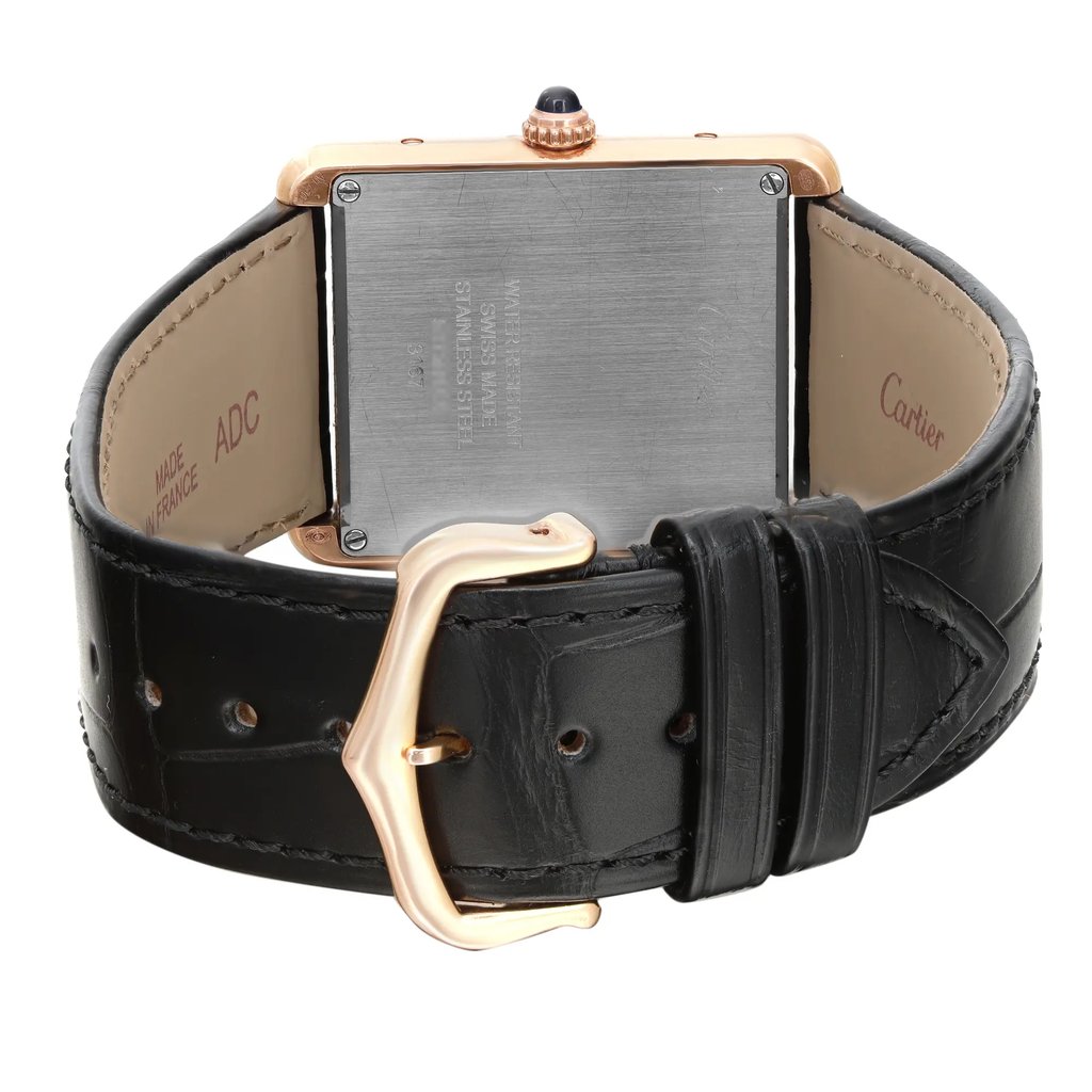 An image of a pre-owned Cartier women's wristwatch with a rectangle shape, viewed from the back showing the closed clasp. The watch has a rose gold screwback case positioned at the center and a black leather band with a buckle closure. The caseback is engraved with the brand and watch specifics, and the band exhibits minor signs of wear. The rose gold buckle and the image is taken from a close, slightly angled distance, emphasizing the details of the caseback and clasp.