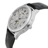 An image of a pre-owned Jaeger-LeCoultre men's luxury wristwatch, captured from a side profile angle highlighting the crown. The watch features a meteorite silver dial with a moon phase and a small seconds subdial, encased in stainless steel with a round shape. The bezel is gray and the leather band appears to be black. The photo is taken at a close distance, with the watch occupying the majority of the frame, showcasing its elegant design and features.