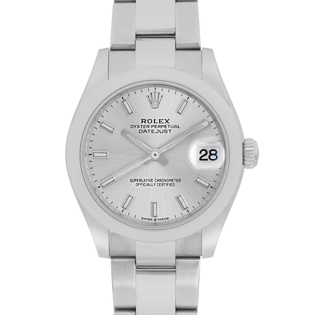 An image of a pre-owned women's Rolex wristwatch, taken from a front-facing angle at a close distance. The watch features a stainless steel bracelet and a silver dial with stick hour markers. The date is displayed at the 3 o'clock position, and the watch has the classic Rolex crown logo at the 12 o'clock position. The overall design is sleek and elegant, showcasing the watch's timeless style.