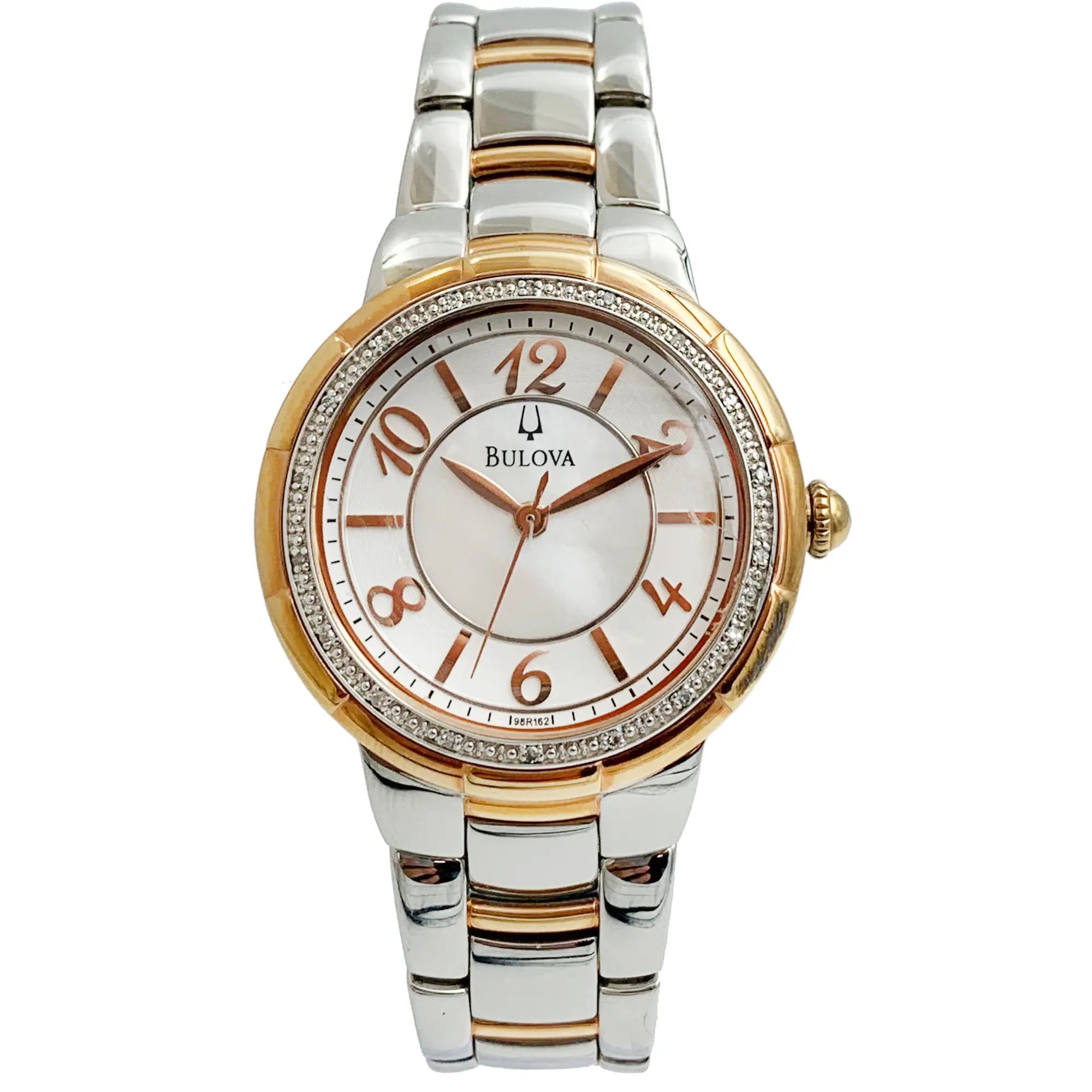 An image of a pre-owned Bulova wristwatch for women, displayed frontally with a direct view of the watch face. The watch is positioned vertically with the 12 o'clock mark at the top, approximately at eye level. The wristwatch features a round, rose gold-tone bezel adorned with diamonds, a white dial with rose gold-tone hands, and Roman numeral hour markers. The Bulova logo is visible below the 12 o'clock mark. The bracelet is silver and rose gold-tone with a center folding clasp, visible in full from the watch face down. The image is shot from a close distance, showing clear details of the watch's design and condition.