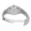 An image of a pre-owned men's Rolex wristwatch viewed from the back at a slight angle, highlighting the closed clasp and stainless steel bracelet. The watch is positioned centrally, with the camera capturing it from a close distance, focusing on the details of the bracelet links and the engraved inner clasp.
