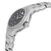An image of a pre-owned wristwatch viewed from the side profile, highlighting the crown. The watch features a silver metal bracelet and a dark dial adorned with diamond markers. The bezel is encrusted with small diamonds, and the brand name is visible on the dial. The angle emphasizes the watch's thickness and the design of the bracelet links.