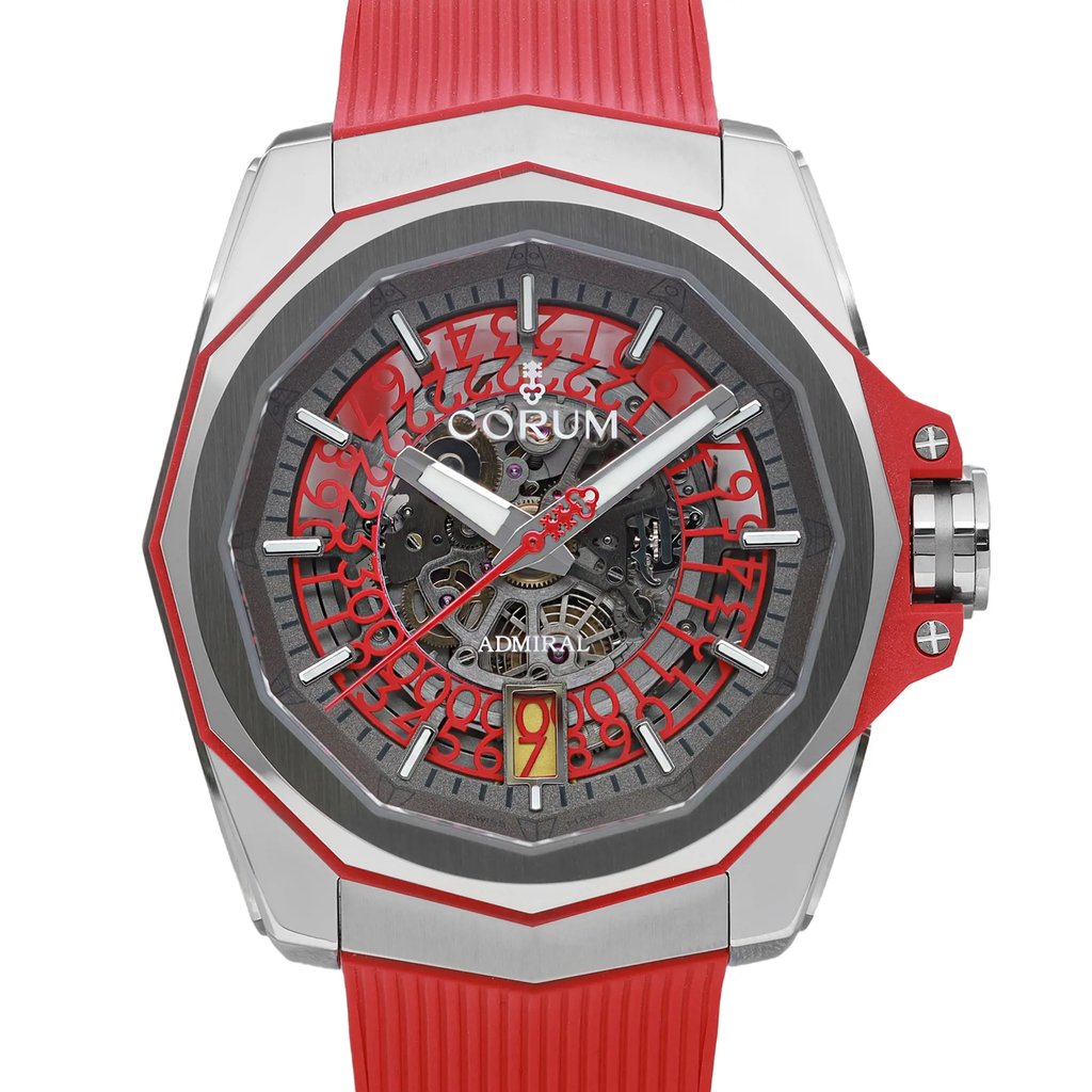 An image of a wristwatch showcasing a front close-up shot of the watch face. The watch features a detailed design with a red and silver color scheme, visible gears, and intricate numbering. The strap is red and textured, complementing the watch's bold and modern aesthetic.
