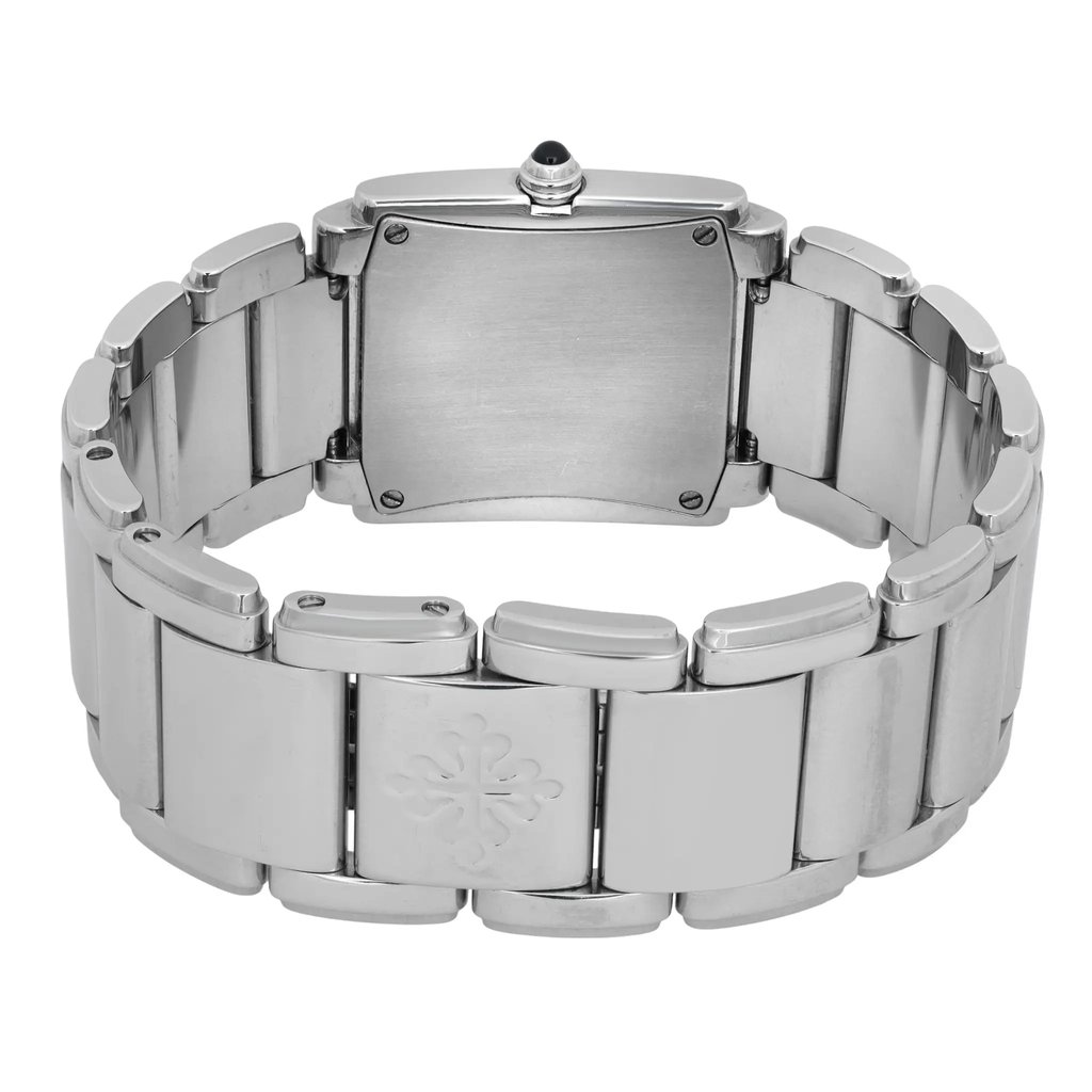 An image of a pre-owned women's Patek Philippe wristwatch, viewed from the back at a slight angle. The focus is on the stainless steel bracelet and the case back, which is centrally positioned. The bracelet features a subtle engraved logo, and a dark cabochon adorns the crown at the top center. The image is taken at a close distance, highlighting the watch's polished metal finish and craftsmanship.