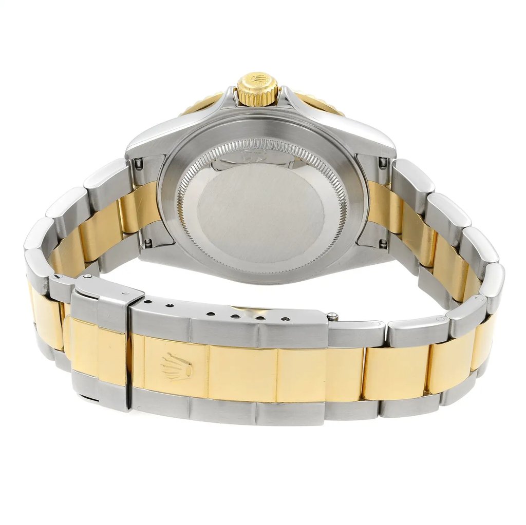 An image of a pre-owned Rolex men's wristwatch shown from the back view, with a close clasp. The watch features a fold-over clasp with a flip lock safety, visible on the stainless steel and solid gold band. The round case material is stainless steel with a screwback caseback. The watch is positioned at a slight angle, with the caseback centered and the band extending outwards on both sides, indicating the curvature around the wrist. The image is taken from a medium distance, allowing clear visibility of the band's materials and the clasp details. The watch shows minor scratches.