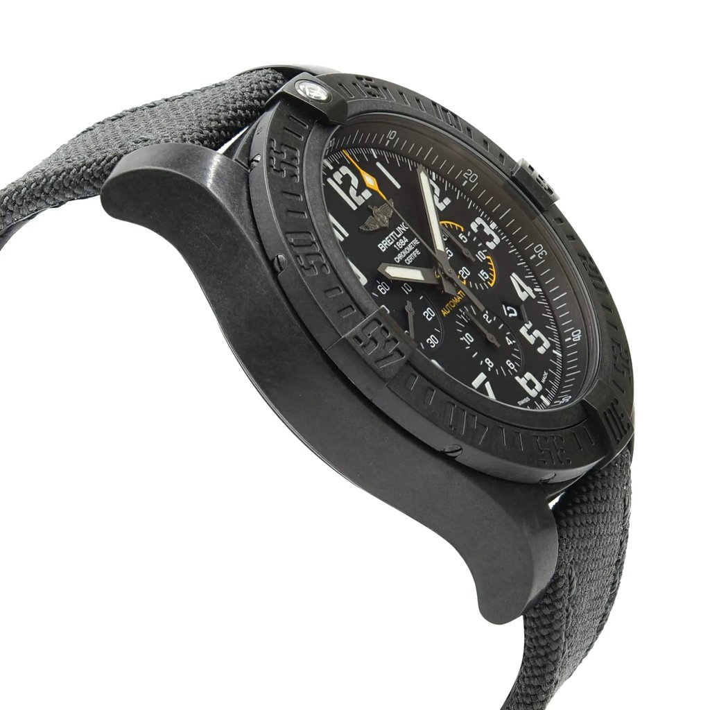 An image of a wristwatch viewed from the side profile, opposite the crown. The watch is positioned at a slight angle, showcasing its sleek, black case and textured strap. The face of the watch displays detailed markings and hands, indicating it is a display model. The image is taken from a close distance, highlighting the intricate details of the timepiece.