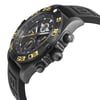 An image of a pre-owned Breitling men's wristwatch in a pilot/aviator style, captured from a side profile angle showcasing the crown. The watch features a round stainless steel case with a black bezel and a black rubber band. The dial is black with yellow accents, and the watch is positioned at a slight angle to highlight its features, with the watch face and crown prominently visible and the band extending into the background. The watch is pre-owned and shows light signs of wear and scratches. 