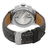 An image of a Breitling men's wristwatch, display model, viewed from a top-down angle slightly tilted to show the back of the watch. The watch is positioned with its strap revealing the mechanical details through a transparent case back. The strap appears to be made of dark grey leather with beige stitching. The distance is close enough to clearly see the brand name and the mechanical components inside the casing. The watch is a display model and has never been worn, there may be minor blemishes on the band due to store handling.