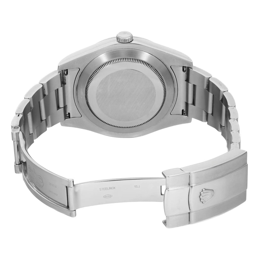 An image of a pre-owned wristwatch shown from the back view. The watch is positioned with the clasp open, displaying the stainless steel bracelet and the back of the watch case. The angle provides a clear view of the inner clasp, showcasing engravings and the overall build quality. The distance is close-up, highlighting the details and texture of the metal components.