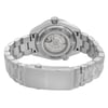 An image of an unworn women's OMEGA wristwatch, showcasing the back view from a close angle. The stainless steel case and exhibition caseback display intricate internal mechanisms. The stainless steel band is visible, leading to a fold-over clasp with a double push button. The watch is in excellent condition, highlighting features like the date indicator and luminous hands. The round shape and overall design emphasize elegance and precision.