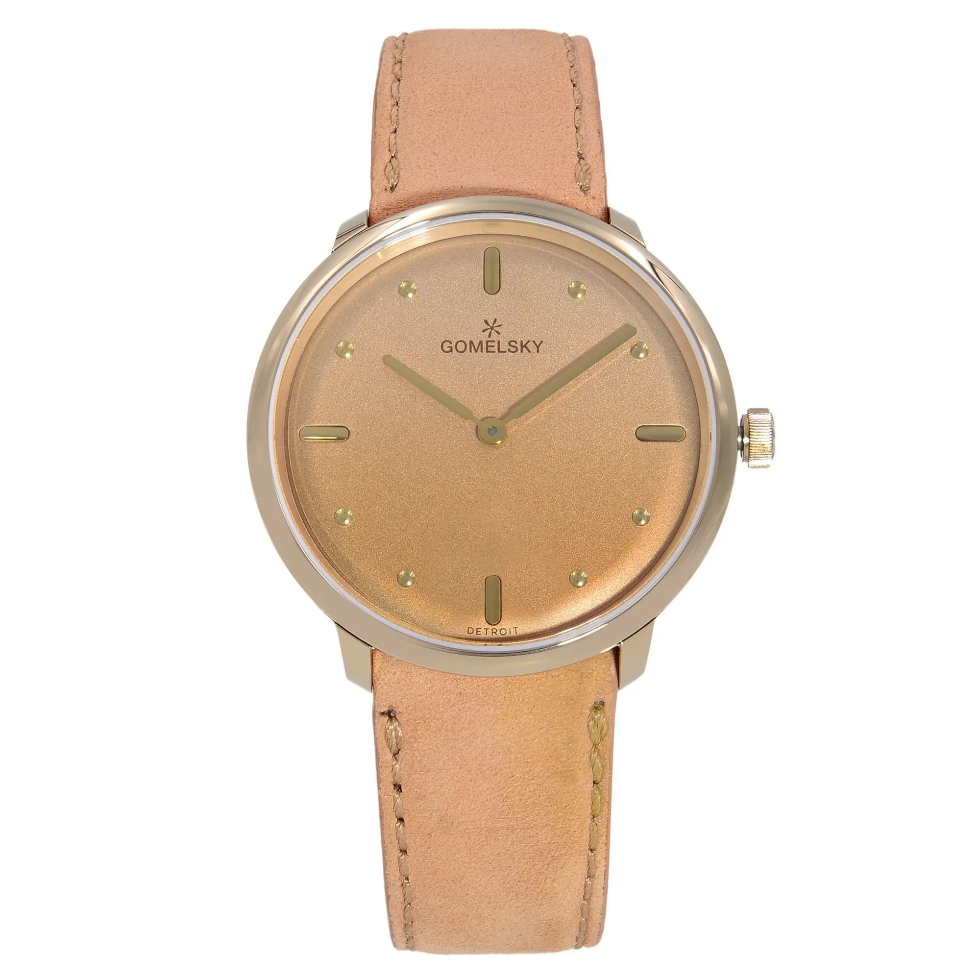 An image of a wristwatch taken from a front full frontal view. The watch is in unworn condition, featuring a round face with a soft gold hue and minimalistic design. It has slender hour and minute hands, with dot markers at each hour position. The strap is light brown leather, complementing the watch face. The brand name is visible on the dial. The image captures the watch directly and centrally, highlighting its pristine and elegant design.