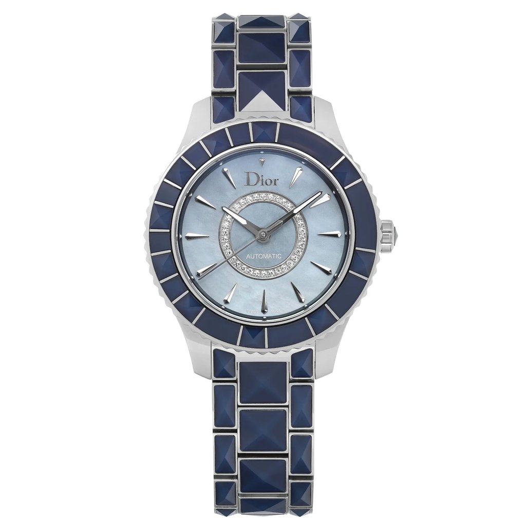 An image of a Wristwatch by Dior. This Display Model item is designed for Women, featuring a Luxury style. It has a Mechanical (Automatic) movement and an Analog display with a Blue dial color. The indices include 12-Hour Dial,Stick Indexes. The band is made of Stainless Steel,Sapphire and the case is made of Stainless Steel. The watch has a Round shape with a case size of 38 mm and a case thickness of 11 mm.