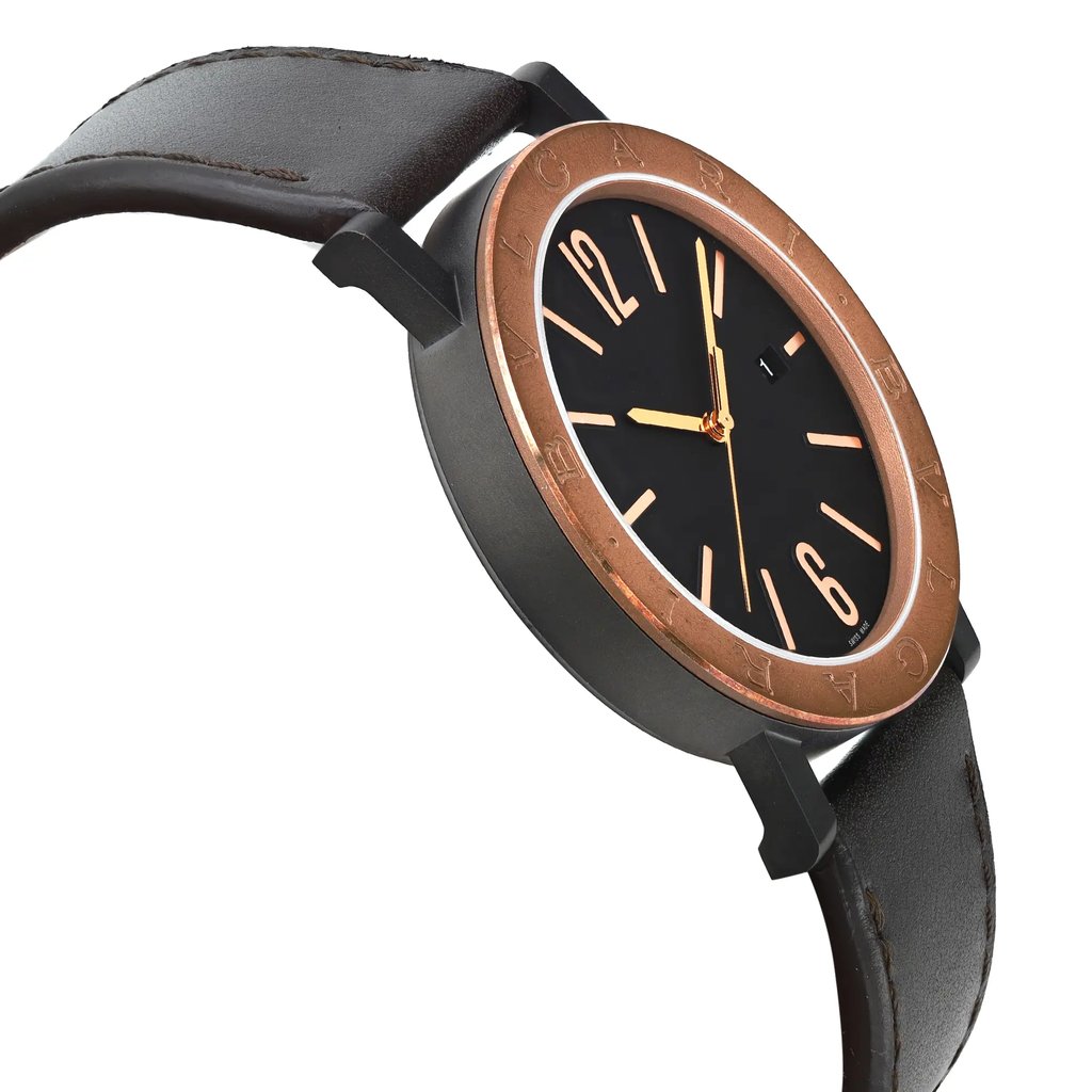 An image of a new Bvlgari men's wristwatch, positioned in a side profile view opposite the crown, displaying a black dial with a bronze bezel. The watch features a round Black DLC stainless steel case and a casual dark brown leather strap. The photo is taken from a close distance, capturing the watch from a side angle that emphasizes its sleek design and the contrast between the dial color and the bezel. The watch is unworn.