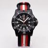 An image of a Wristwatch by Luminox. This Pre Owned item is designed for Men, featuring a Casual style. It has a Quartz movement and an Analog display with a Black dial color. The indices include 12-Hour Dial,24-Hour Dial,Easy to Read/Large Numerals. The band is made of Nylon and the case is made of Carbon. The watch has a Round shape with a case size of 45 mm and a case thickness of 13 mm.