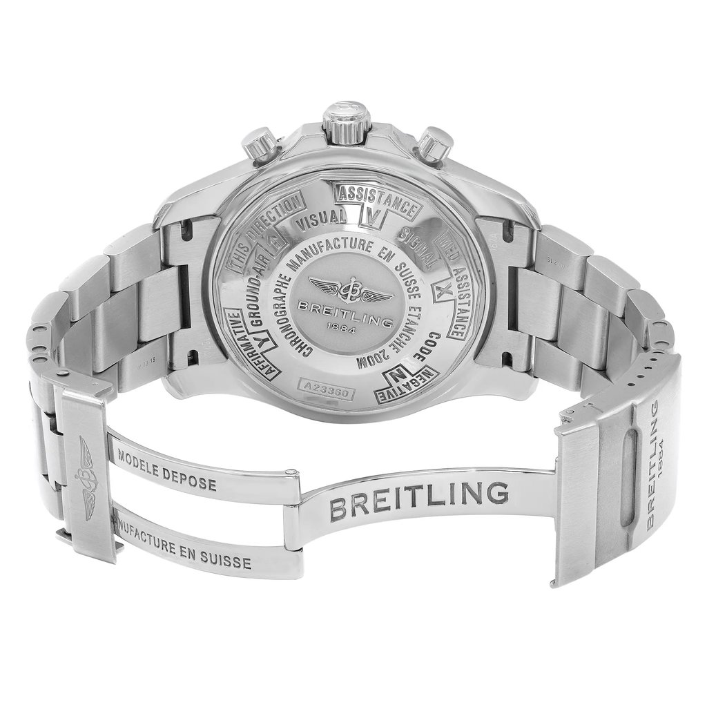 An image of a pre-owned Breitling men's wristwatch with an open clasp, shown from the back view. The watch is made of stainless steel with a screwback case back and a round watch shape. It features a fold-over clasp with a flip-lock safety. The watch is positioned at a slight angle, giving a clear view of the back and the clasp, and is photographed from a medium distance. The watch is pre-owned and may show signs of wear and scratches.