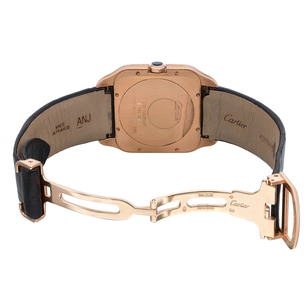 An image of a pre-owned wristwatch shown from the back view, with the clasp open. The watch is positioned centrally, displaying the back case and the inner side of the strap from a slightly elevated angle. The distance allows a clear view of the inscriptions on both the back of the watch and the clasp, highlighting details such as the brand and manufacturing country. The watch's clasp is fully extended, showcasing its design and closure mechanism.