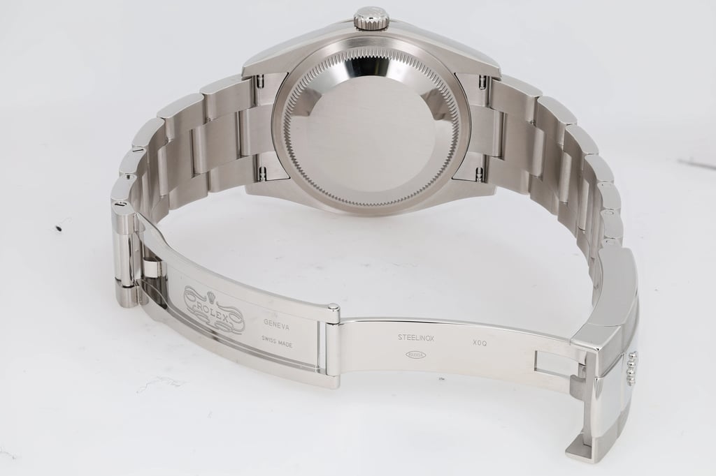 Back View Of Solid Back Case And Open Stainless Steel Band Of Rolex 126234 Watch New Condition