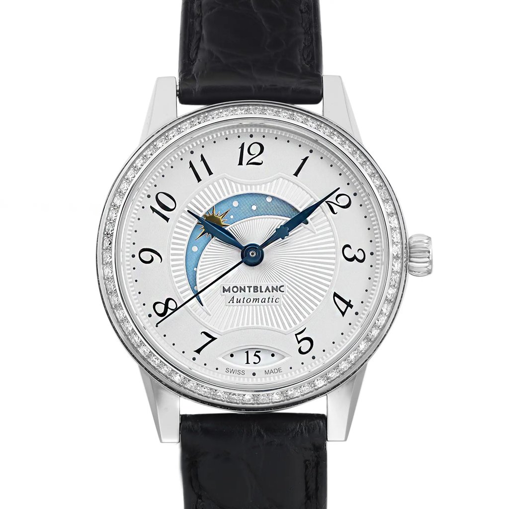 An image of a pre-owned Montblanc luxury wristwatch for women, shown in a front close-up view. The watch face is round with a silver dial featuring gray Arabic numerals and a seconds hand, encased in stainless steel with a gray bezel adorned with diamonds. It has a black leather band, and the Montblanc name is displayed below the on center. The hands of the watch are blue, and there is a small day/night indicator. The photo is taken from a direct front angle, focusing on the watch face with a close-up shot that captures fine details while the band extends partially out of the frame.