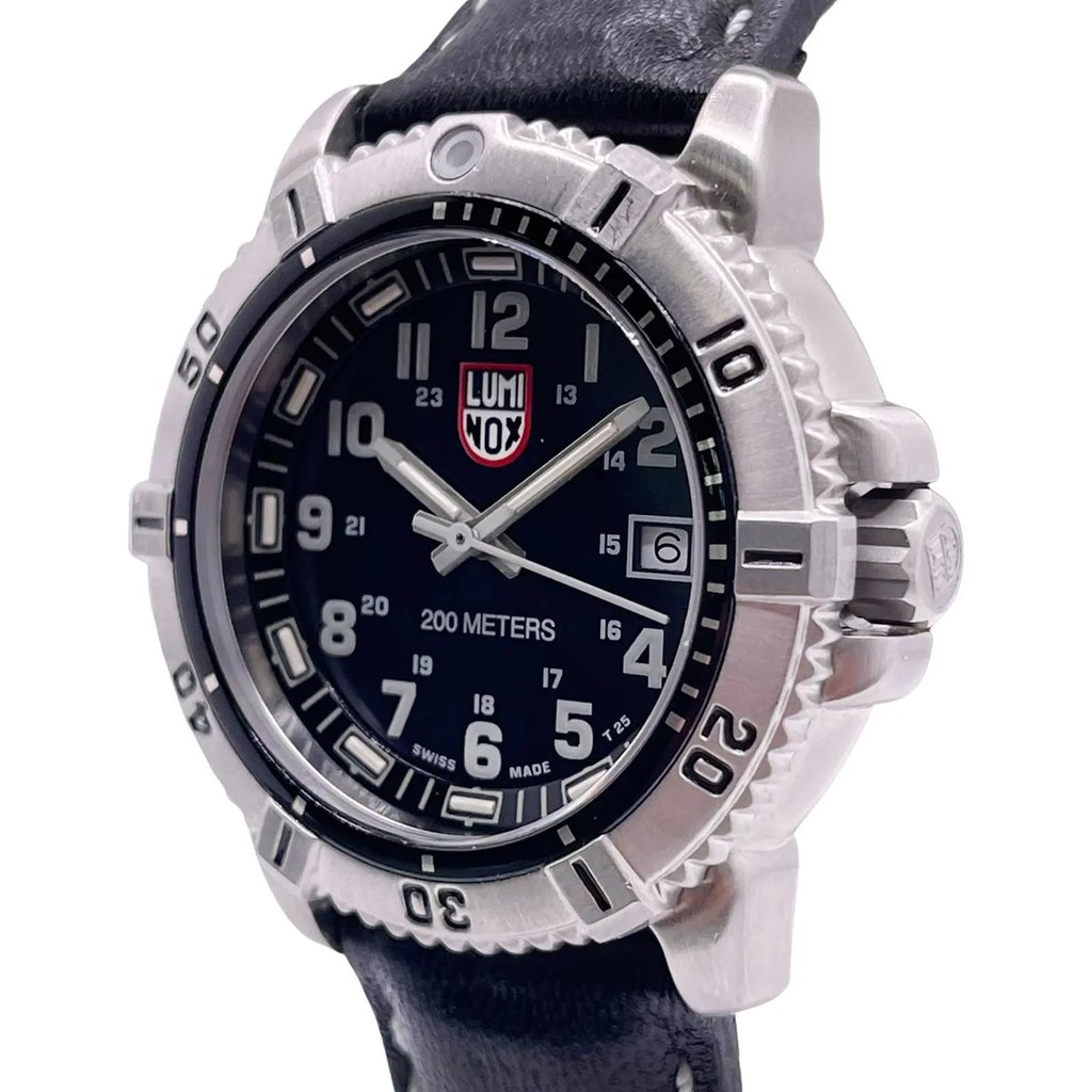An image of a Wristwatch by Luminox. This Pre Owned item is designed for Women, featuring a Dress/Formal,Military style. It has a Quartz movement and an Analog display with a Black dial color. The indices include 12-Hour Dial,24-Hour Dial,Arabic Numerals,Easy to Read/Large Numerals. The band is made of Leather and the case is made of Stainless Steel. The watch has a Round shape with a case size of 38 mm and a case thickness of 11 mm.