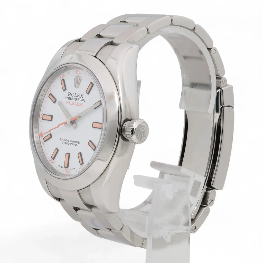 An image of a pre-owned men's Rolex wristwatch displayed at a slight angle from the front-right, showcasing the watch face and part of the bracelet. The watch features a white dial with luminous hands and markers. The case and bracelet are made of polished metal. The watch is positioned upright on a clear stand, with the side and crown visible. The image is taken at a close distance, emphasizing the watch's details.