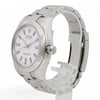 An image of a pre-owned men's Rolex wristwatch displayed at a slight angle from the front-right, showcasing the watch face and part of the bracelet. The watch features a white dial with luminous hands and markers. The case and bracelet are made of polished metal. The watch is positioned upright on a clear stand, with the side and crown visible. The image is taken at a close distance, emphasizing the watch's details.