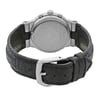 An image of a pre-owned wristwatch showing the back view. The watch is positioned upright, with a focus on the closed clasp. The angle highlights the watch’s stainless steel back, displaying engraved details. The black leather strap is prominently featured, and the image is taken from a close distance, capturing the texture of the strap and the shine of the metal clasp.