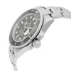 An image of a pre-owned wristwatch shown from a side profile view, highlighting the crown. The watch is positioned at an angle, displaying its sleek design and metallic bracelet. The distance is close enough to capture fine details on the watch face and the textured crown.