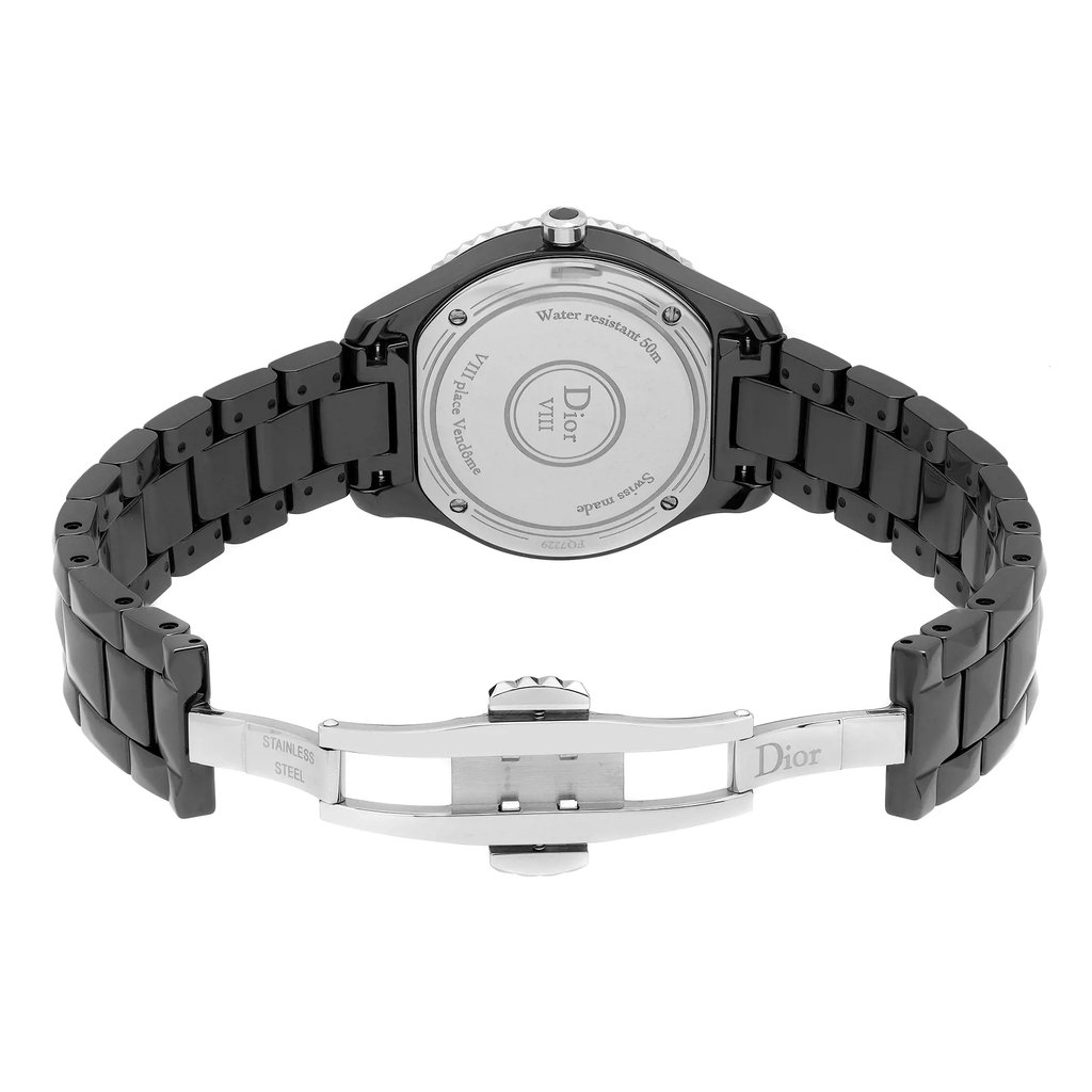 An image of a wristwatch taken from the back view, showcasing the open clasp. The watch is positioned upright with the bracelet extending outwards, highlighting the brand engraving on the clasp and the details on the case back. The angle is slightly elevated, providing a clear view of the stainless steel links and the backplate inscriptions. The image is captured at a moderate distance, focusing on the display model's craftsmanship.