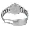 An image of a pre-owned wristwatch taken from the back view, showing the open clasp. The watch is positioned centrally with a slightly elevated angle, allowing a clear view of the engraved back case and stainless steel bracelet. The image is taken from a moderate distance, highlighting the intricate details of the clasp and the design on the case back.