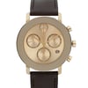An image of a pre-owned wristwatch taken from a front close-up angle, showcasing the watch face. The timepiece features a gold-tone dial with three subdials and a date window at the 4 o'clock position. The watch has a dark brown leather strap and a polished metal case with buttons on the side.