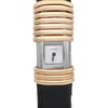 An image of a pre-owned wristwatch, shown in a front close-up shot of the watch face. The watch has a rectangular dial with a metallic finish and minimalistic design. The bezel is adorned with several polished gold rings, and the strap is dark in color. The brand name is visible on the watch face.