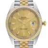 An image of a pre-owned Rolex Oyster Perpetual Datejust men's wristwatch, presented in a front close-up view highlighting the watch face at a straight-on angle. The watch features a luxurious round champagne dial encased in stainless steel, with a gold bezel and a stainless and solid gold band. The dial includes 12-hour indices, a seconds hand, and luminous hands, with a date indicator displayed at the 3 o'clock position. The condition is excellent, with minor signs of wear or scratches visible upon close inspection. The Rolex logo and the text "Superlative Chronometer Officially Certified" are discernible on the dial.