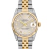 An image of a pre-owned wristwatch captured in a front close-up shot, focusing on the watch face. The watch features a silver and gold two-tone design with a gold fluted bezel. The face displays diamond hour markers and a date window at the 3 o'clock position. The bracelet consists of alternating gold and silver links.