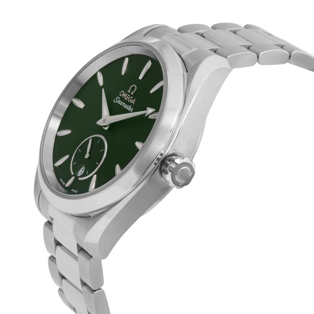 An image of a wristwatch viewed from the side profile, showcasing the crown prominently. The watch features a stainless steel bracelet and a green dial. Photographed at a slight angle and close-up, highlighting its unworn condition and intricate design details.