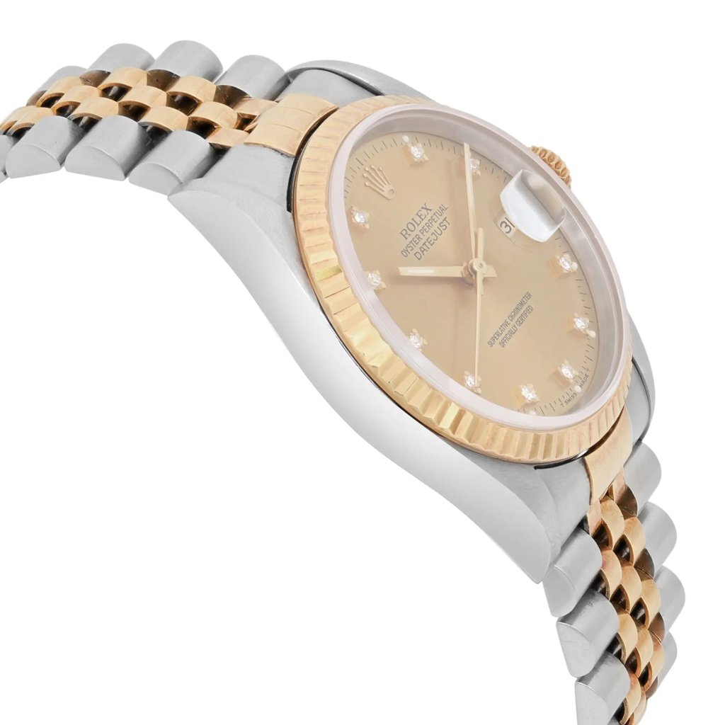 An image of a pre-owned men's Rolex wristwatch, viewed from a slight side angle and positioned close-up. The watch features a two-tone metal bracelet with gold and steel links. The face is a champagne color with diamond hour markers and a date indicator magnified by a cyclops lens at the 3 o'clock position. The gold fluted bezel adds to the watch's classic design.