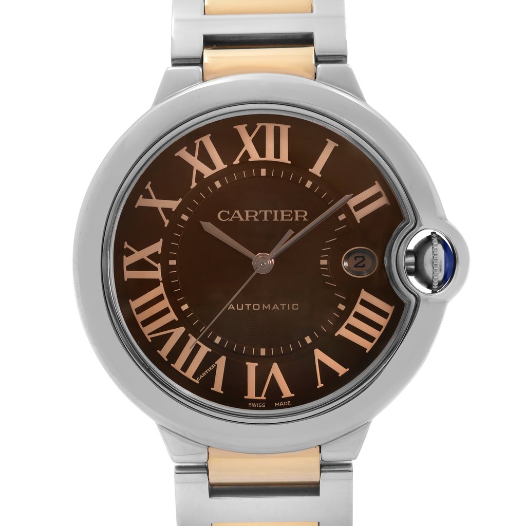 An image of a pre-owned Cartier men's luxury wristwatch shown in a front close-up view. The watch face is round with a sunburst brown dial, featuring Roman numeral indices and a 12-hour dial format. There is a small date window at the 3 o'clock position. The bezel is made of steel, and the watch has a combination stainless steel and 18k rose gold band. The watch has an automatic movement and includes a signature blue cabochon crown situated on the right side of the case, which is visible in the image. 