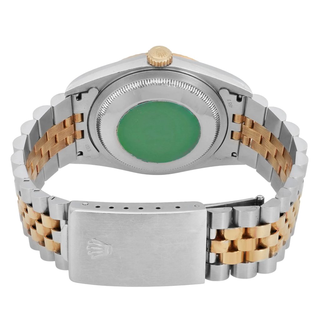 An image of a pre-owned men's Rolex wristwatch, viewed from the back at a close distance. The watch is positioned horizontally, showcasing its two-tone metal bracelet and the green sticker on the case back. The crown is visible at the top center, and the bracelet's clasp is prominently displayed in the foreground.