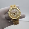 An image of a Wristwatch by Michael Kors. This New With Defects item is designed for Men, featuring a Casual style. It has a Quartz movement and an Analog display with a Champange Mother of Pearl dial color. The indices include 12-Hour Dial,Stick Indexes. The band is made of Plastic and the case is made of Stainless Steel. The watch has a Round shape with a case size of 43 mm and a case thickness of 13 mm.