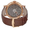 An image of a pre-owned men's Breguet wristwatch taken from the back view, showcasing the exhibition caseback. The watch features a rose gold round case and a brown leather band with a buckle closure. The angle highlights the intricate mechanics within the case, emphasizing the power reserve indicator. The close-up perspective offers a clear view of the watch's detailed craftsmanship.