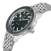 An image of an unworn men's wristwatch from Rado, shown from a side profile view highlighting the crown. The round watch features a green dial and bezel, with a stainless steel band and case. The watch is positioned at a slight angle, emphasizing its casual style and craftsmanship.